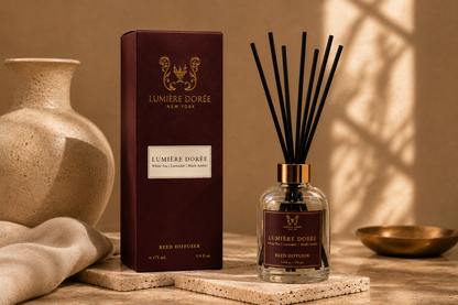 LUMIÈRE DORÉE Signature Reed Diffuser with elegant glass bottle and natural reed sticks for home fragrance.