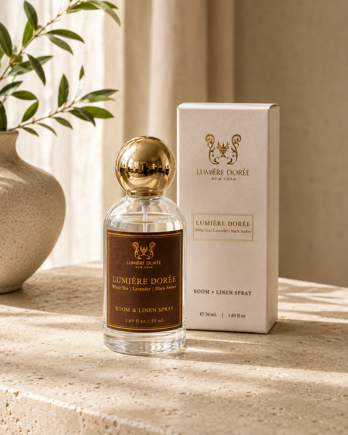 LUMIÈRE DORÉE luxury room and linen spray bottle with elegant packaging, designed to add a fine home fragrance to any space.