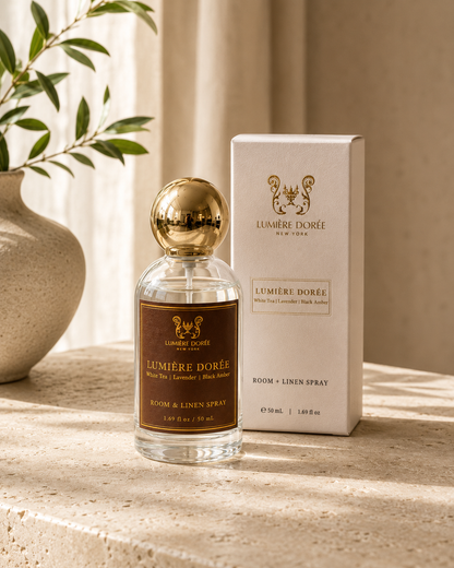 LUMIÈRE DORÉE luxury room and linen spray bottle with elegant packaging, designed to add a fine home fragrance to any space.