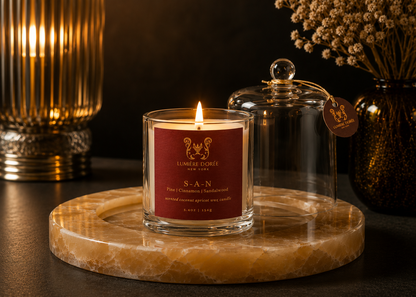 Lumière Dorée Signature Cloche Candle in a glass container, elegant luxury candle for home fragrance and sophisticated decor.